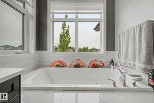 Deep soaking tub with polished chrome fixtures - 3036 59 Avenue, Rural Leduc County, AB 