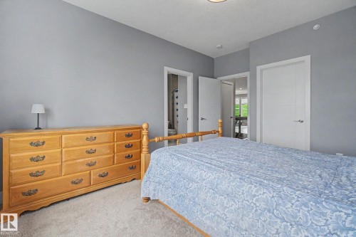 Carpeted room with light gray walls and white trim - 3036 59 Avenue, Rural Leduc County, AB 