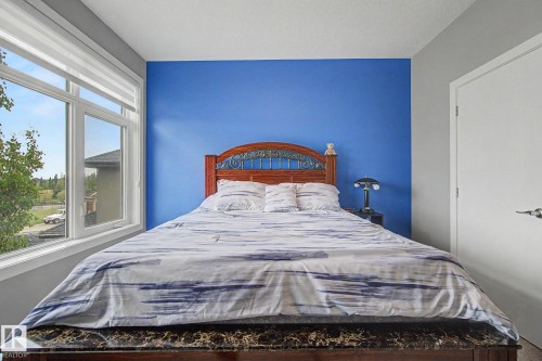 Bright room with large multi-pane window featuring horizontal blinds - 3036 59 Avenue, Rural Leduc County, AB 