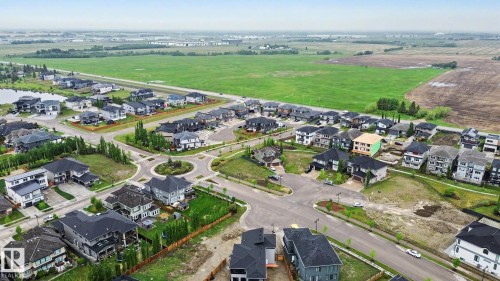Developed residential area with contemporary homes and a central roundabout - 3036 59 Avenue, Rural Leduc County, AB 