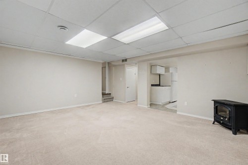 Carpeted recreation area featuring drop ceiling with recessed lighting - 2068 45 Street, Edmonton, AB - Indoor Photo Showing Other Room