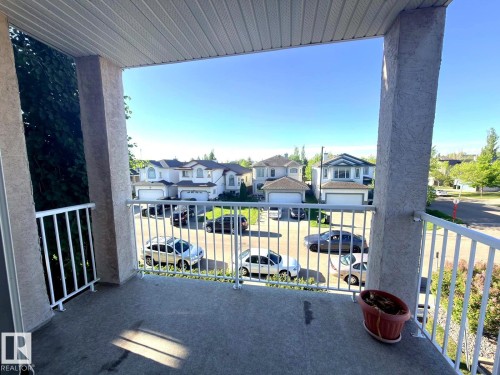 Private balcony featuring a concrete surface and white metal railings - 312 2305 35A Avenue, Edmonton, AB 