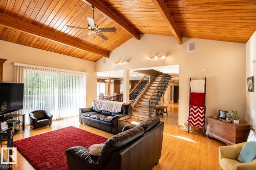 Vaulted wood-paneled ceiling with exposed beams - 58124 Secondary 881, Rural St. Paul County, AB - Indoor Photo Showing Living Room