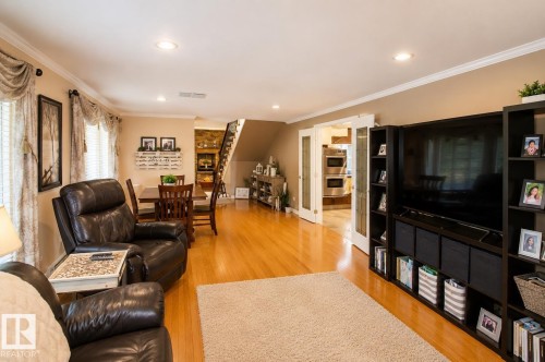 Hardwood flooring throughout the main living area - 58124 Secondary 881, Rural St. Paul County, AB - Indoor Photo Showing Living Room