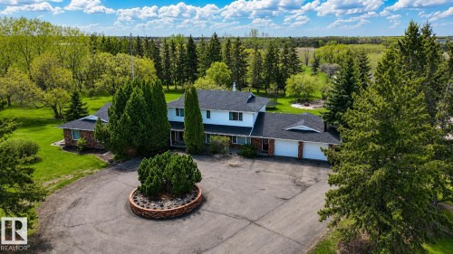 Expansive property featuring a multi-level residence with a three-car garage - 58124 Secondary 881, Rural St. Paul County, AB - Outdoor