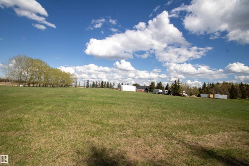 Expansive green field extending to a treeline - 58124 Secondary 881, Rural St. Paul County, AB - Outdoor With View