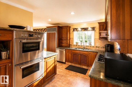 Stainless steel double wall ovens - 58124 Secondary 881, Rural St. Paul County, AB - Indoor Photo Showing Kitchen With Double Sink