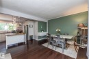Kitchen and dining area featuring dark wood-finish flooring - 7719 86 Avenue, Edmonton, AB 