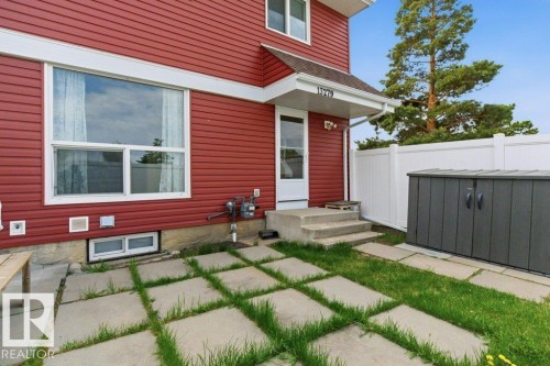 Exterior with red horizontal siding and white trim - 13279 47 Street, Edmonton, AB - Outdoor