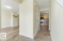 Entryway featuring light-toned wall paint, white baseboards, and ceramic tile flooring - 13279 47 Street, Edmonton, AB  - Indoor 