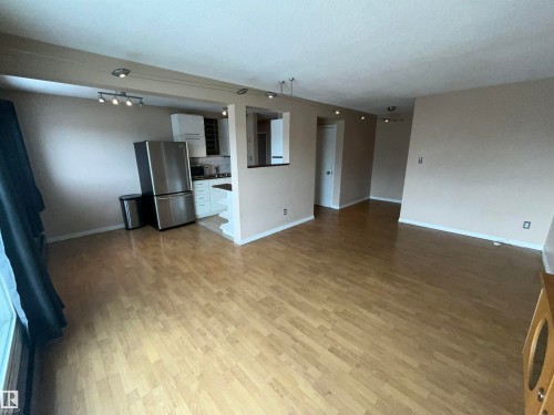 Open-concept living space with wood-finish flooring - 306 11340 124, Edmonton, AB 