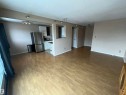 Open-concept living space with wood-finish flooring - 306 11340 124, Edmonton, AB 