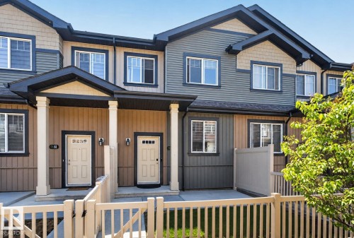 Multi-toned exterior featuring horizontal siding and shingle accents - 62 3305 Orchards Link, Edmonton, AB 