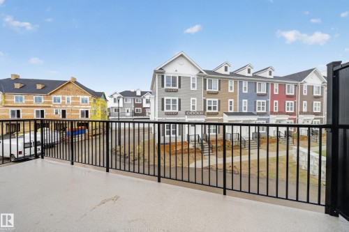 Spacious outdoor patio with black metal railings - 5 903 Crystallina Nera Way, Edmonton, AB 