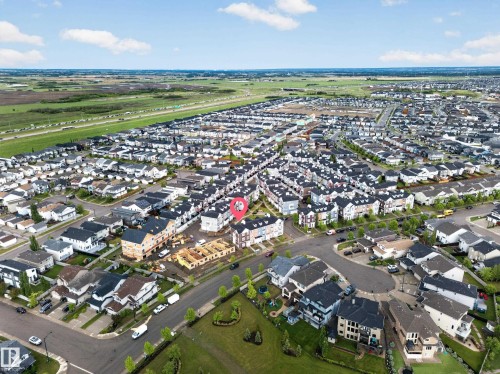 Aerial perspective of a developed residential area with a mix of detached homes and townhomes - 5 903 Crystallina Nera Way, Edmonton, AB 