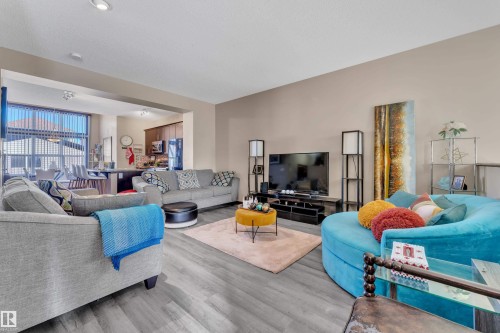 Open-concept living space with wood-finish flooring - 621 Mcdonough Link Link, Edmonton, AB 