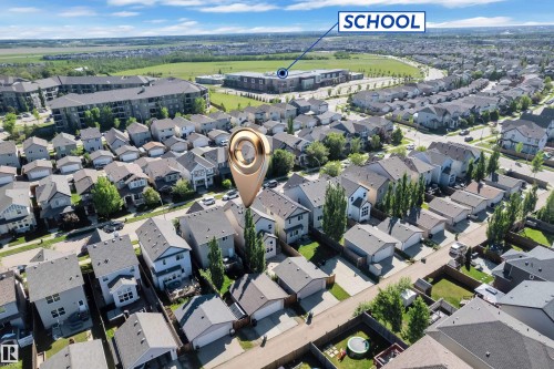 Aerial perspective of a residential neighborhood featuring detached homes with varying rooflines - 621 Mcdonough Link Link, Edmonton, AB 