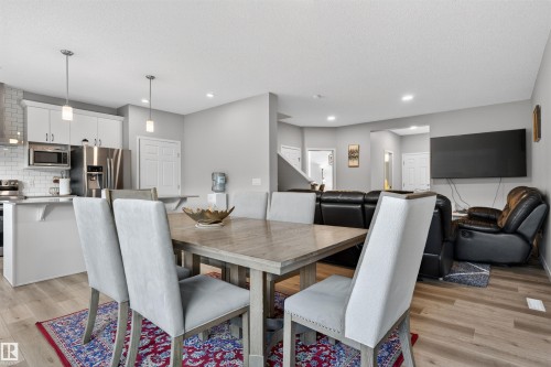 Modern kitchen with white cabinetry and stainless steel appliances - 22638 99A Avenue, Edmonton, AB 
