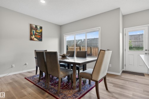 Dining space featuring wood-finish flooring, recessed lighting, and neutral wall tones - 22638 99A Avenue, Edmonton, AB 