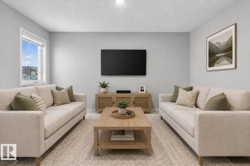 Spacious living area featuring light-toned walls, recessed lighting, and a large window - 22638 99A Avenue, Edmonton, AB 