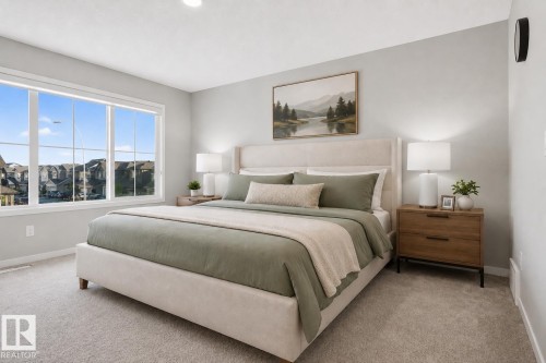 Spacious bedroom featuring light gray walls, large multi-pane windows providing ample natural light, and soft carpeting - 22638 99A Avenue, Edmonton, AB 