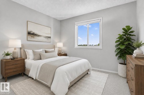 Bedroom featuring light gray walls, textured ceiling, a window with white trim, and light gray carpeting - 22638 99A Avenue, Edmonton, AB 