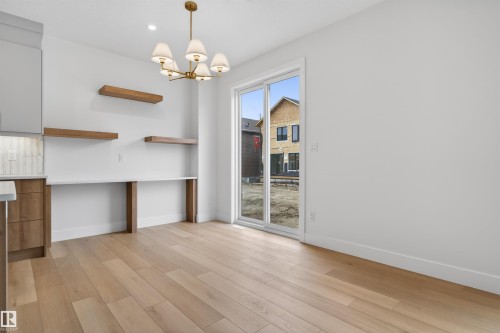 Light wood-finish flooring extending throughout the room - 15 Redbud Way, St. Albert, AB - Indoor