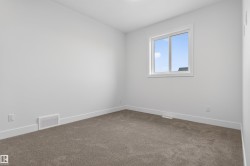 Room featuring neutral wall finishes and plush carpet flooring - 