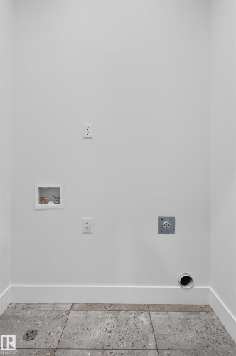 Dedicated utility space featuring a laundry hookup, dryer vent, and electrical outlets - 15 Redbud Way, St. Albert, AB -  Photo Showing Other Room