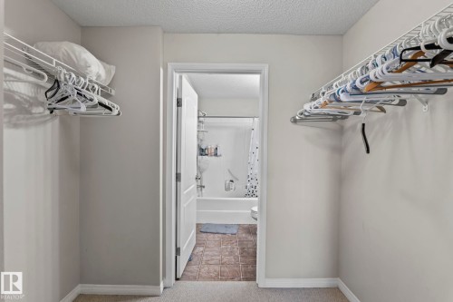 Walk-in closet featuring wire shelving and carpet flooring - 2106 9357 Simpson Dr Nw, Edmonton, AB - Indoor With Storage