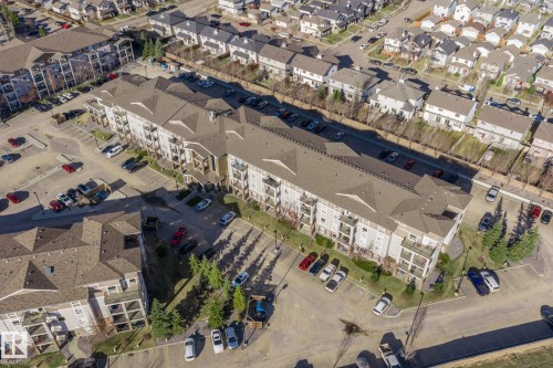 Multi-level residential building featuring private balconies, surface parking, and perimeter landscaping - 2106 9357 Simpson Dr Nw, Edmonton, AB - 