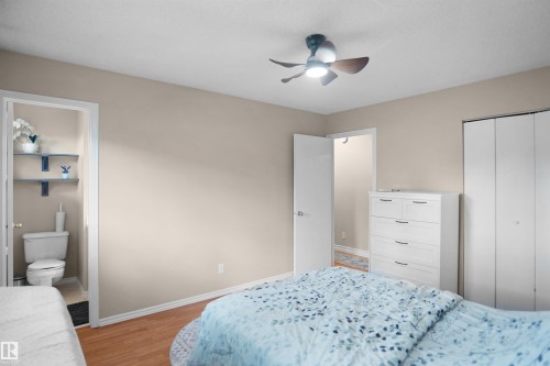 Light-toned walls with wood-finish flooring - 13524 26 Street, Edmonton, AB 