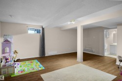 Spacious finished basement with wood-finish flooring - 