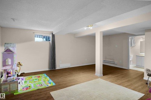 Spacious finished basement with wood-finish flooring - 13524 26 Street, Edmonton, AB 
