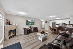 Open concept living area featuring wood-finish flooring - 