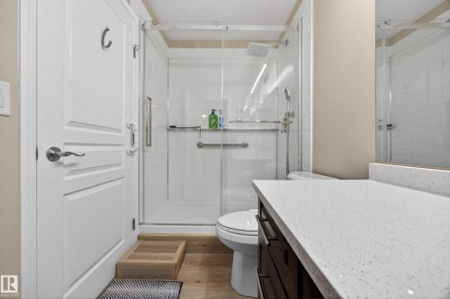Glass-enclosed shower with subway tile surround and rain showerhead - 138 16035 132 Street, Edmonton, AB 