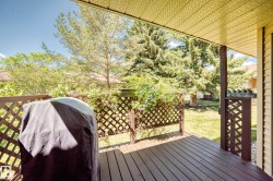 Exterior wooden deck with lattice privacy screening - 
