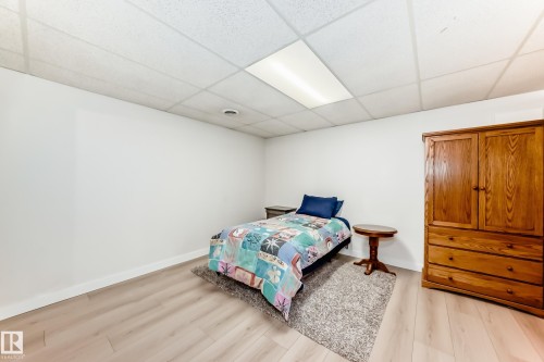 Room with white walls and light wood-finish flooring - 10822 11 Avenue, Edmonton, AB 