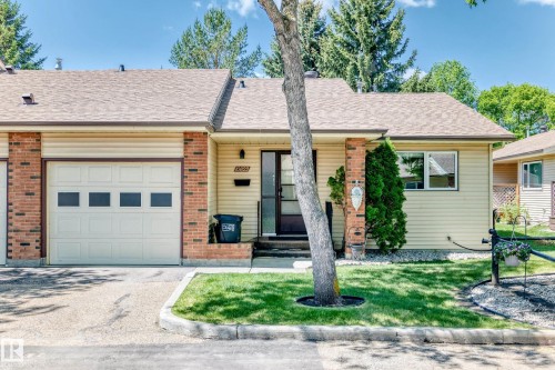 Single-story residence featuring light-colored siding and brick accents - 10822 11 Avenue, Edmonton, AB 
