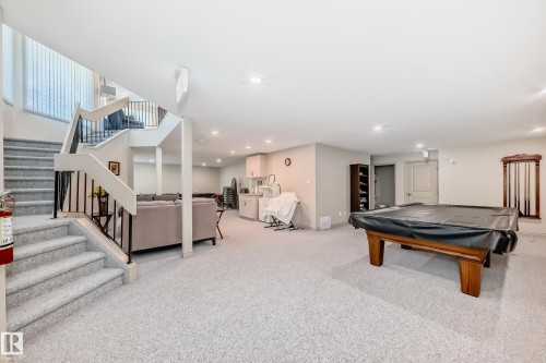 Spacious lower level featuring light-colored carpeting throughout - 10822 11 Avenue, Edmonton, AB 