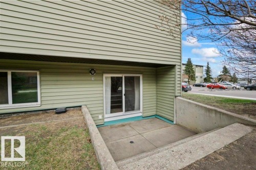 Private concrete patio with direct exterior access - #1 13450 Fort Rd Nw, Edmonton, AB - Outdoor With Deck Patio Veranda With Exterior
