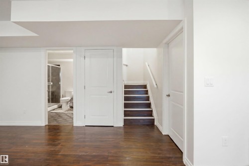 Wood-finish flooring throughout, featuring a bright white color palette - 1560 37B Avenue, Edmonton, AB 