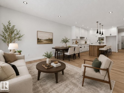 Open-concept living space featuring wood-finish flooring, recessed lighting, and a neutral color palette - 3318 Chickadee Drive, Edmonton, AB 