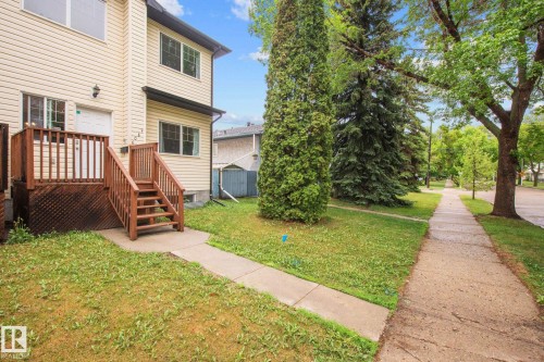 Two-story exterior with light-colored siding - 4806 117 Ave, Edmonton, AB 