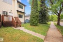 Two-story exterior with light-colored siding - 4806 117 Ave, Edmonton, AB 