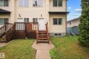 Cream-colored siding facade featuring multiple windows - 4806 117 Ave, Edmonton, AB 