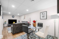 Recreation room featuring recessed lighting, light-toned walls, and wood-finish flooring - 