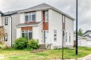 Two-story residence featuring white siding and brown accent panels - 18103 77 Street, Edmonton, AB 