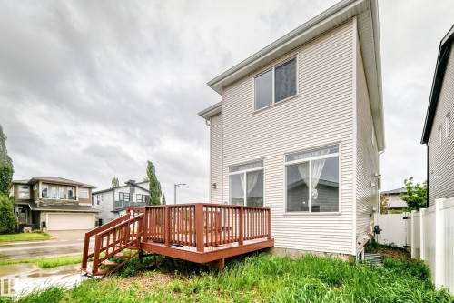 Exterior of a multi-story residence featuring light-colored horizontal siding - 18103 77 Street, Edmonton, AB 