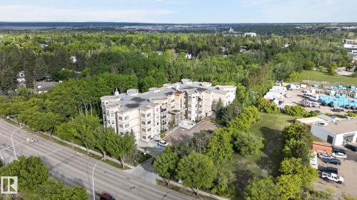 Multi-story residential building featuring a light-toned facade and multiple balconies - 208 5 Gate Avenue, St. Albert, AB 